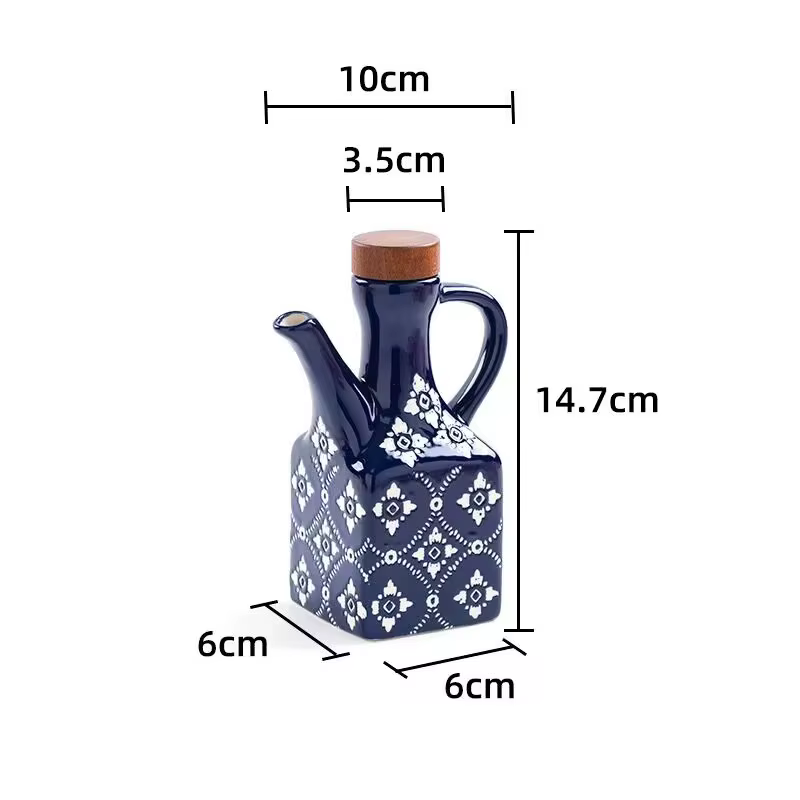 Ensemble de galettes en céramique avec bec verseur, bouteilles d'huile de cuisine et de verre en vin