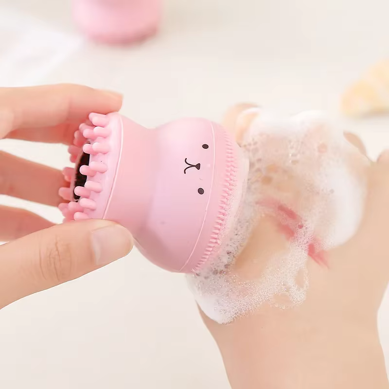Brosse faciale poulpe rose avec éponge